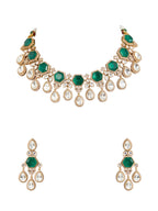 Jewelry set with necklace and earrings featuring green gemstones on a white background

