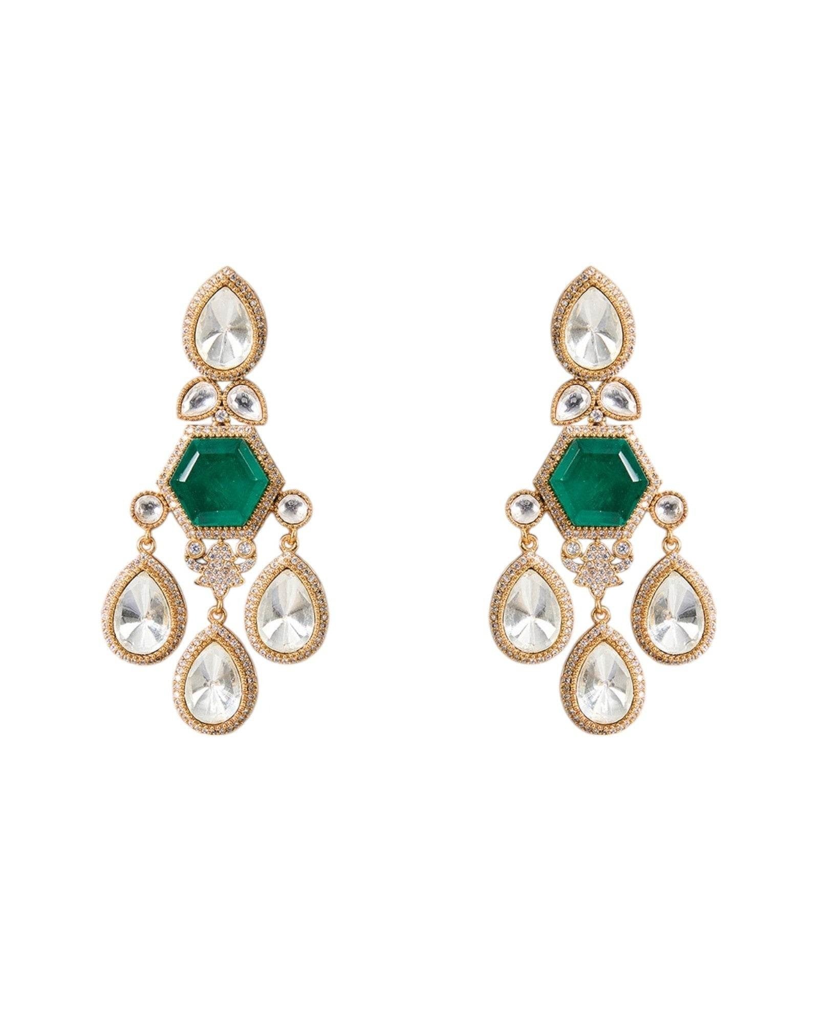 Pair of gold and green earrings on a white background

