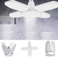 Ceiling fan with light fixture and its components on a gray background